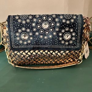 Denim and bling bling clutch style bag with shoulder strap and handle bag